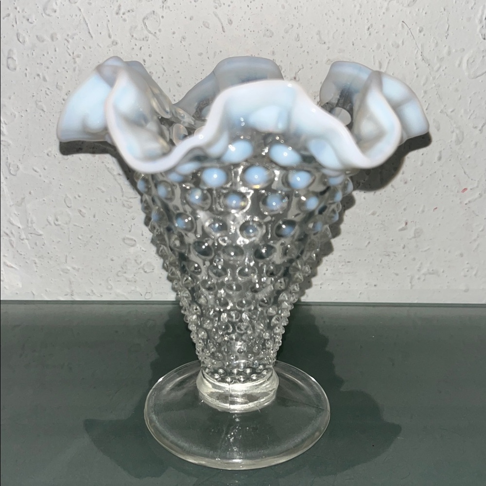 Fenton Hobnail French Opalescent footed fan vase with a crimped edge.